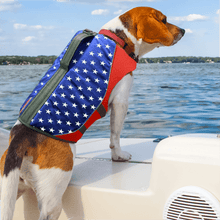 Load image into Gallery viewer, Dog on a boat wearing an american flag patterned life preserver vest