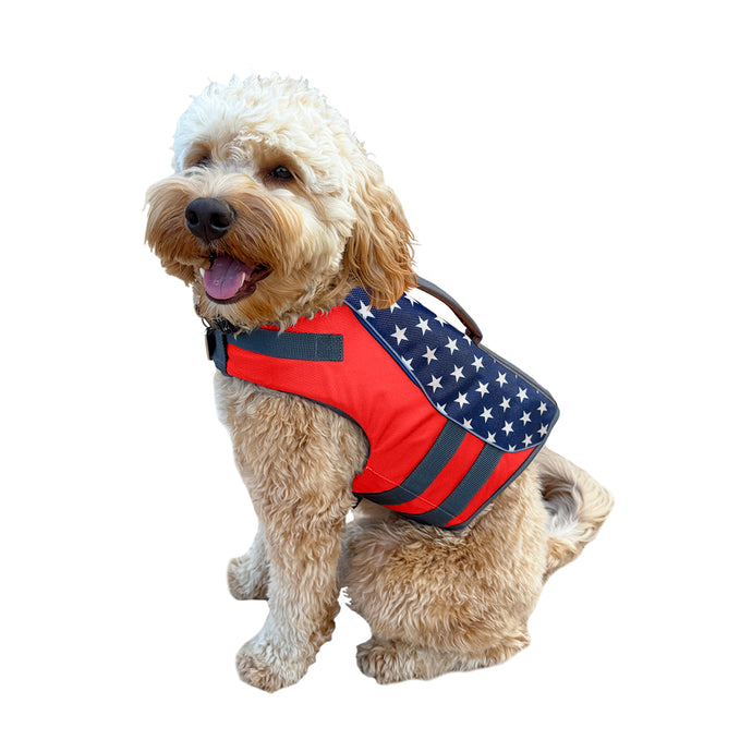 Dog wearing a life preserver float vest in an american flag theme and colors